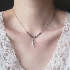 Antique white pearl necklace with a small silver chain